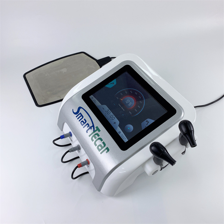 Biała chiropraktyczna maszyna do terapii diatermii kręgosłupa Tecar do przewlekłego bólu